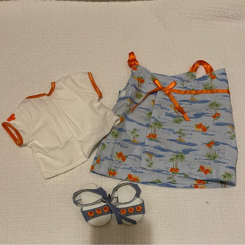American girl bitty baby Hawaiian dress with island floral print.Comes with book